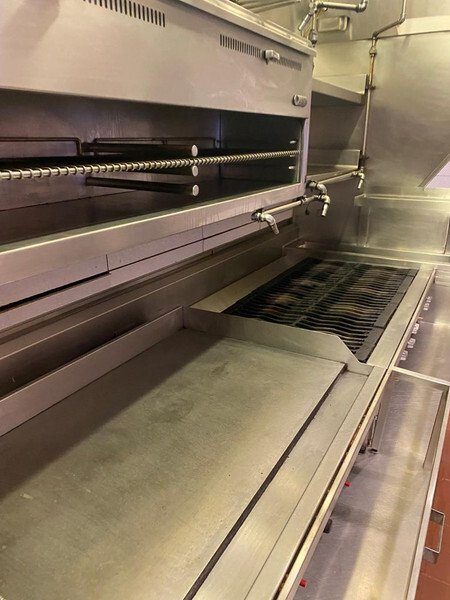 Cleaned broiler and cooking line with polished stainless surfaces
